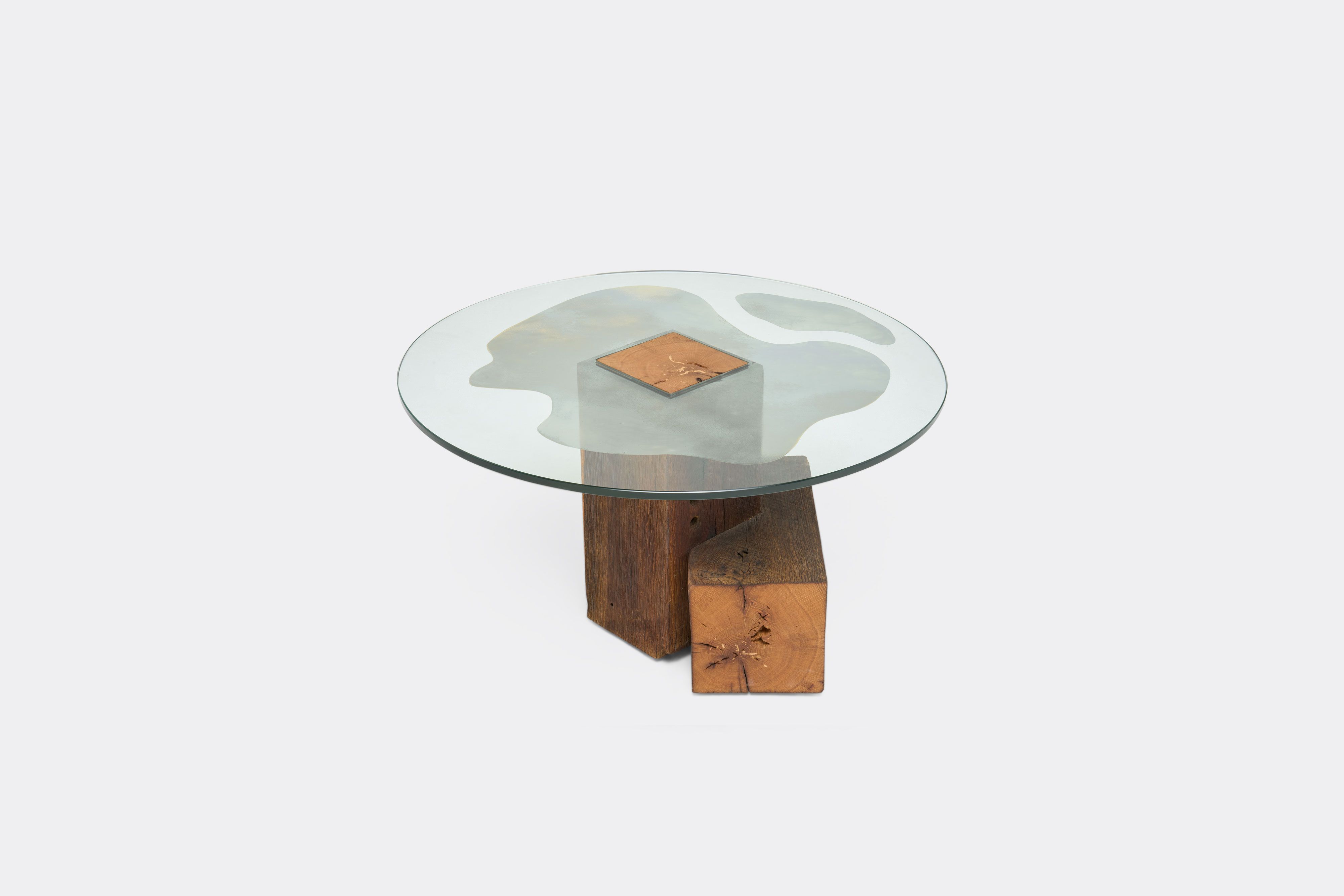 a glass coffee table with a wooden base on a white background .