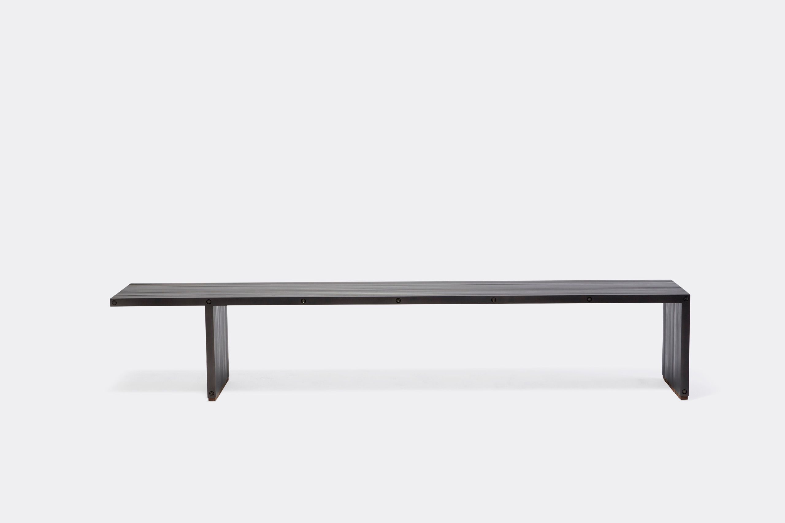 a black aluminum bench on a white background .