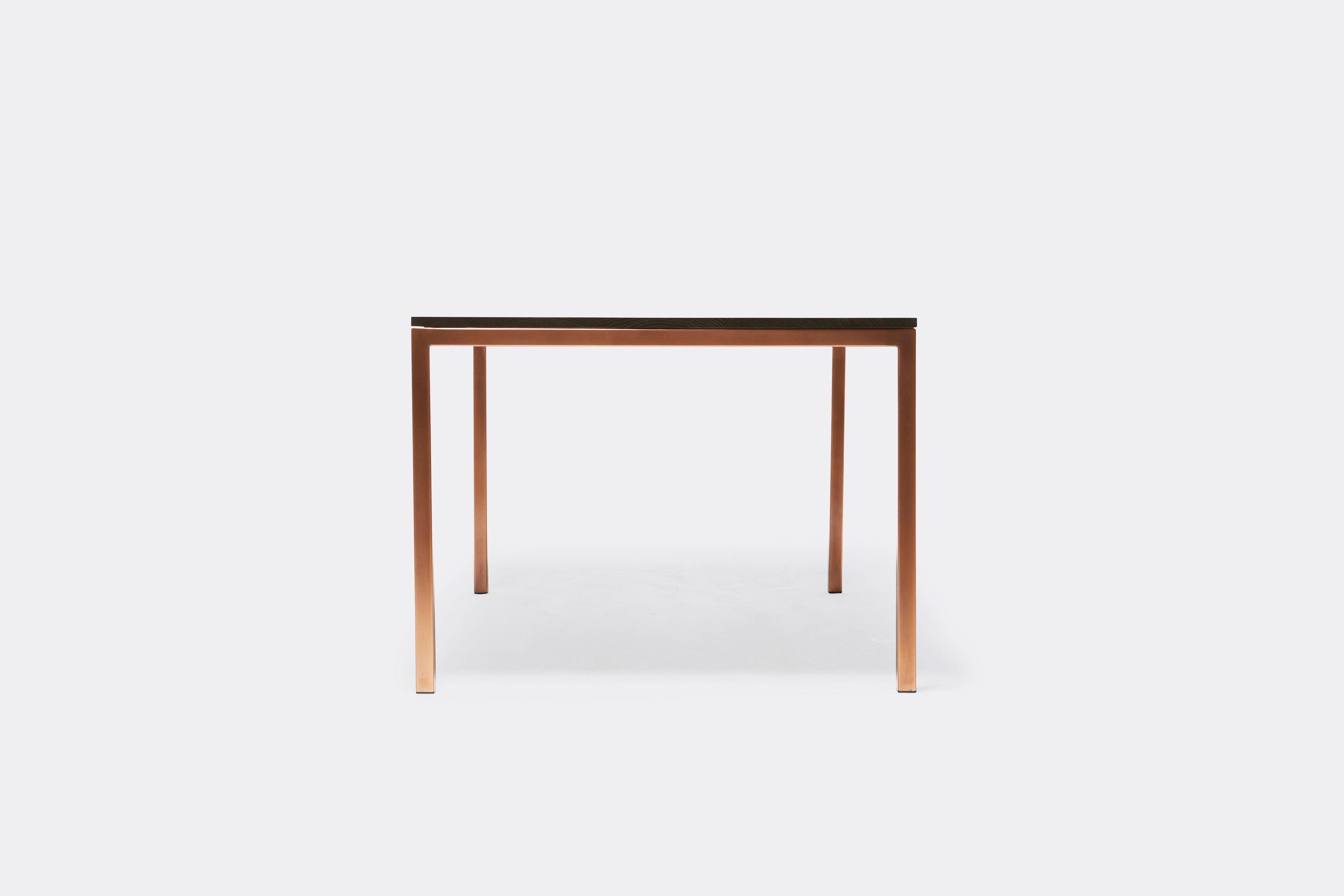 front view of oak and antique copper dining table