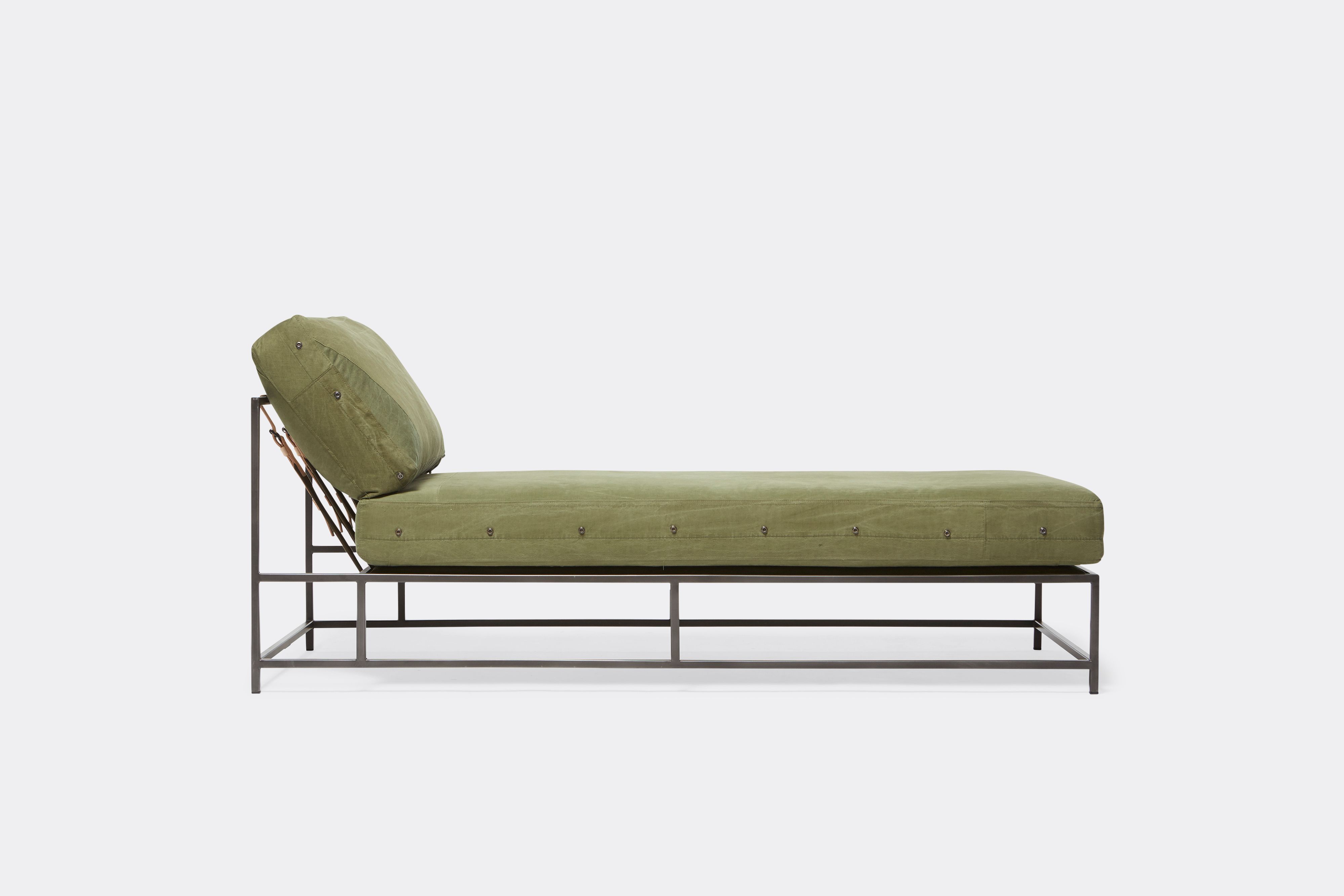 side view of military canvas chaise lounge with blackened steel frame
