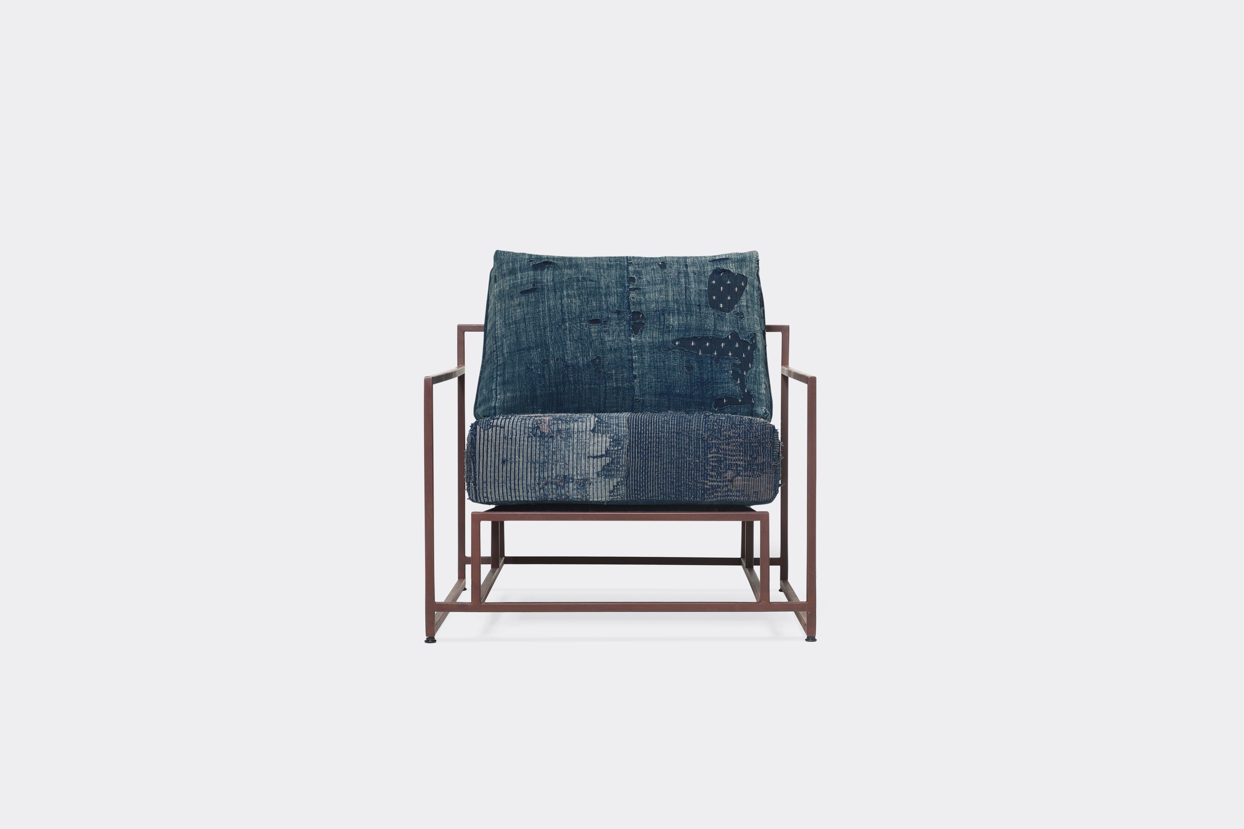 front of armchair with vintage boro upholstery on marbled rust metal frame