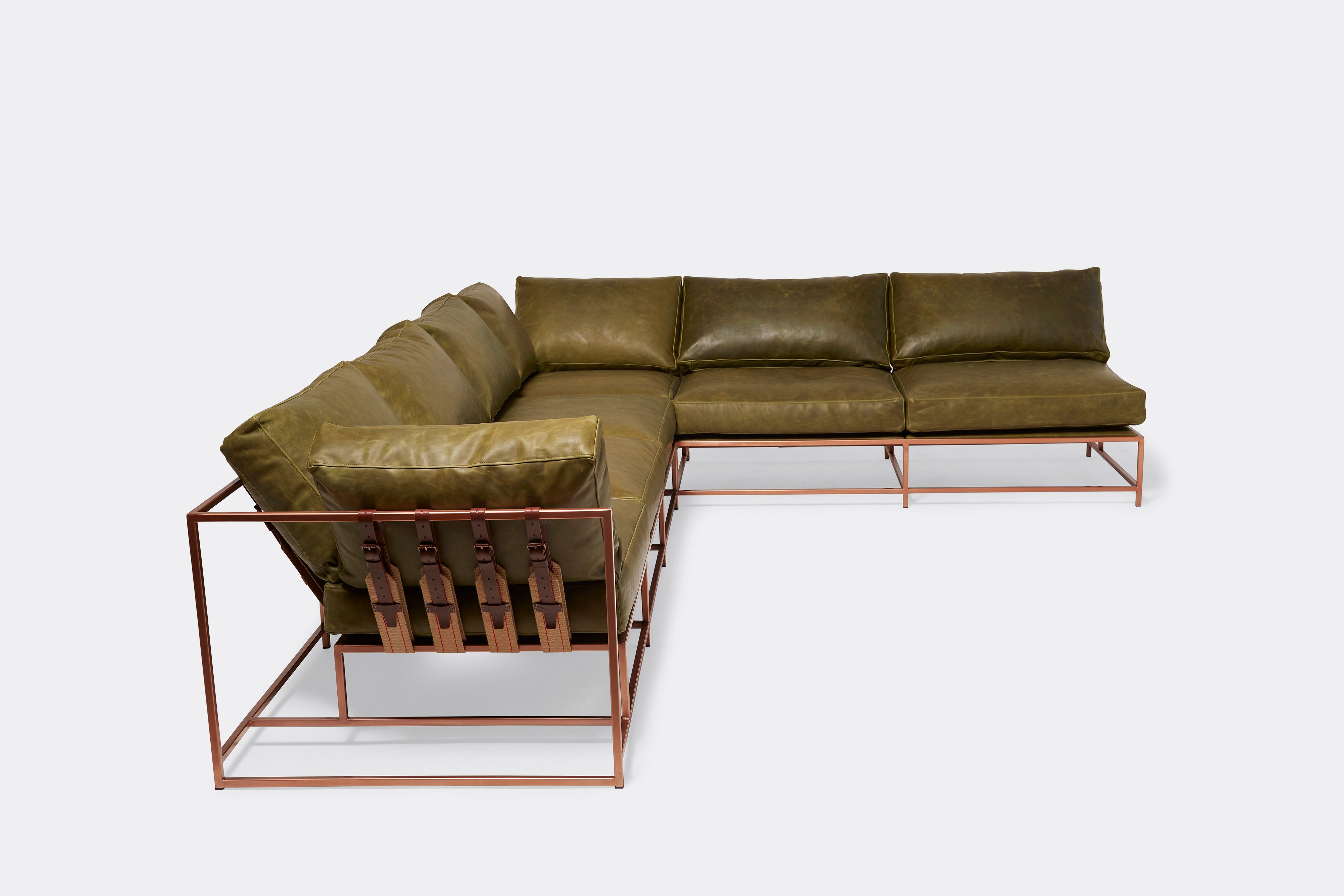 side of sectional with green leather upholstery on antique copper metal frame