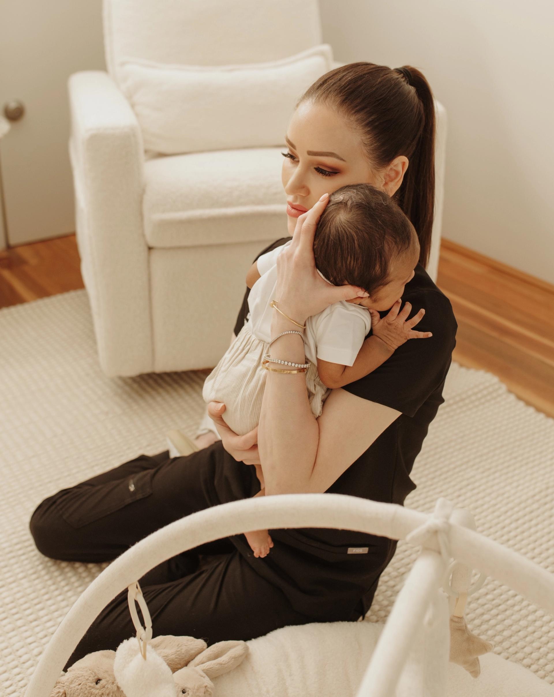 Meg Holding Newborn