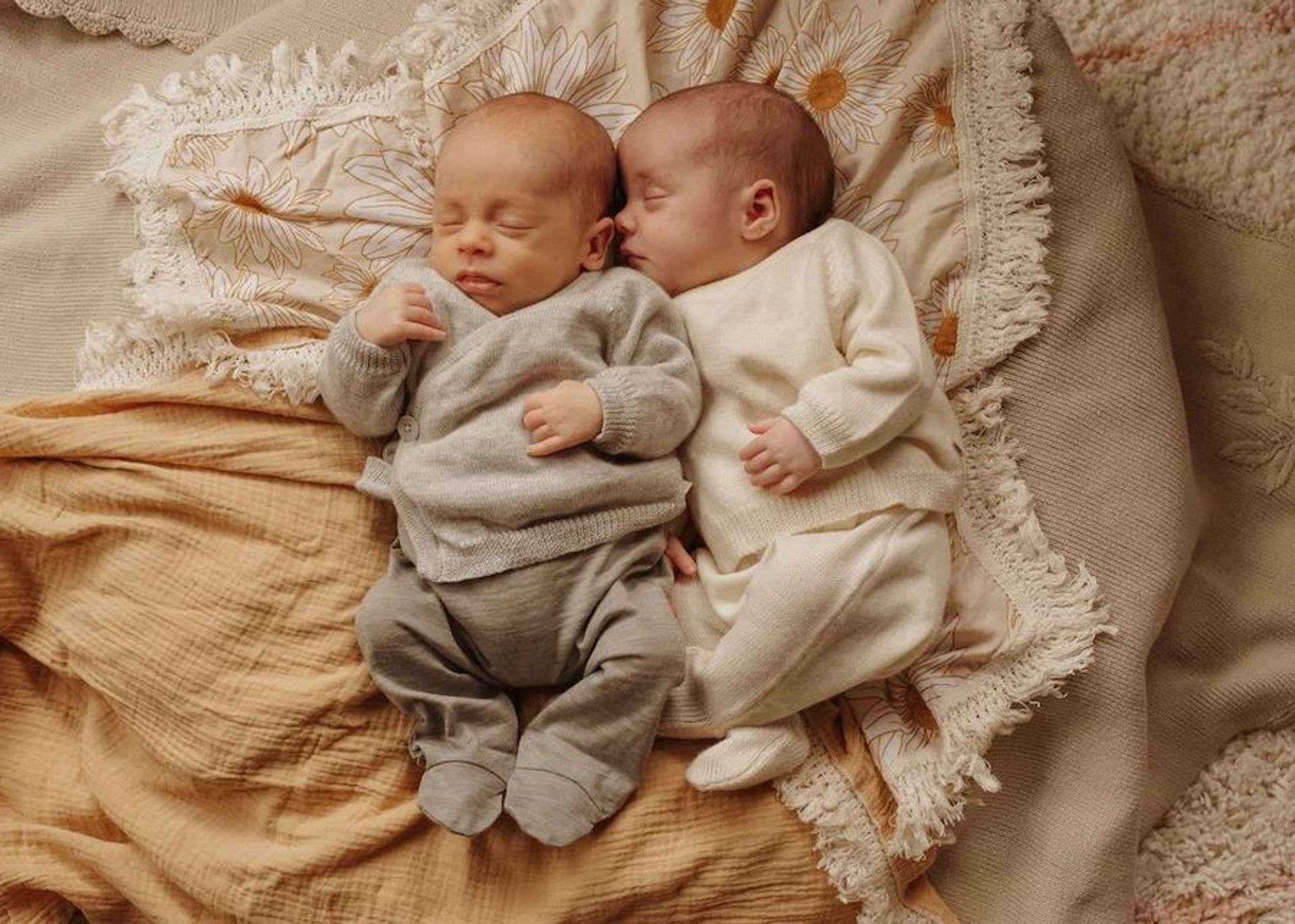 Two newborn babies sleeping