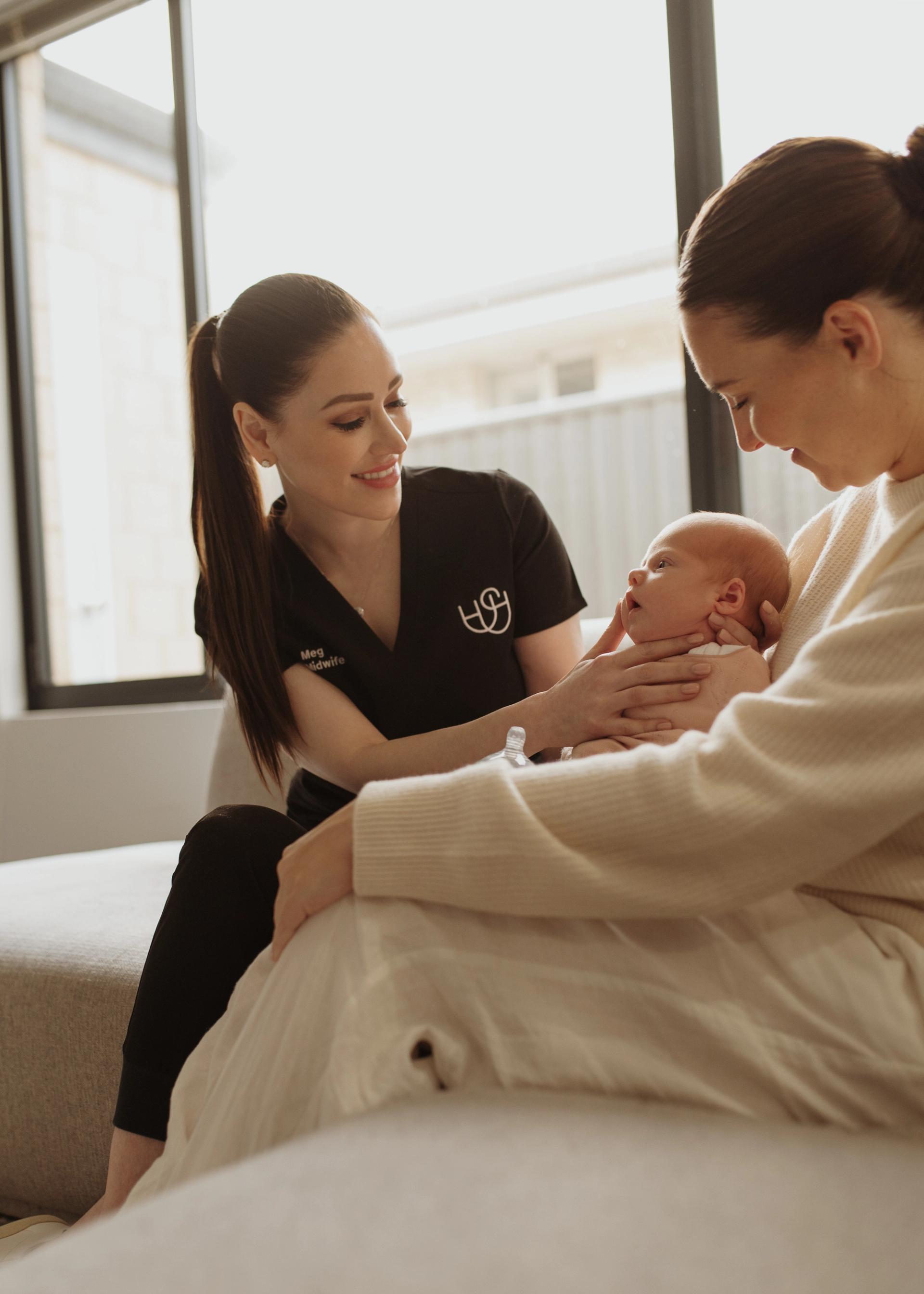 megan holding newborn baby
