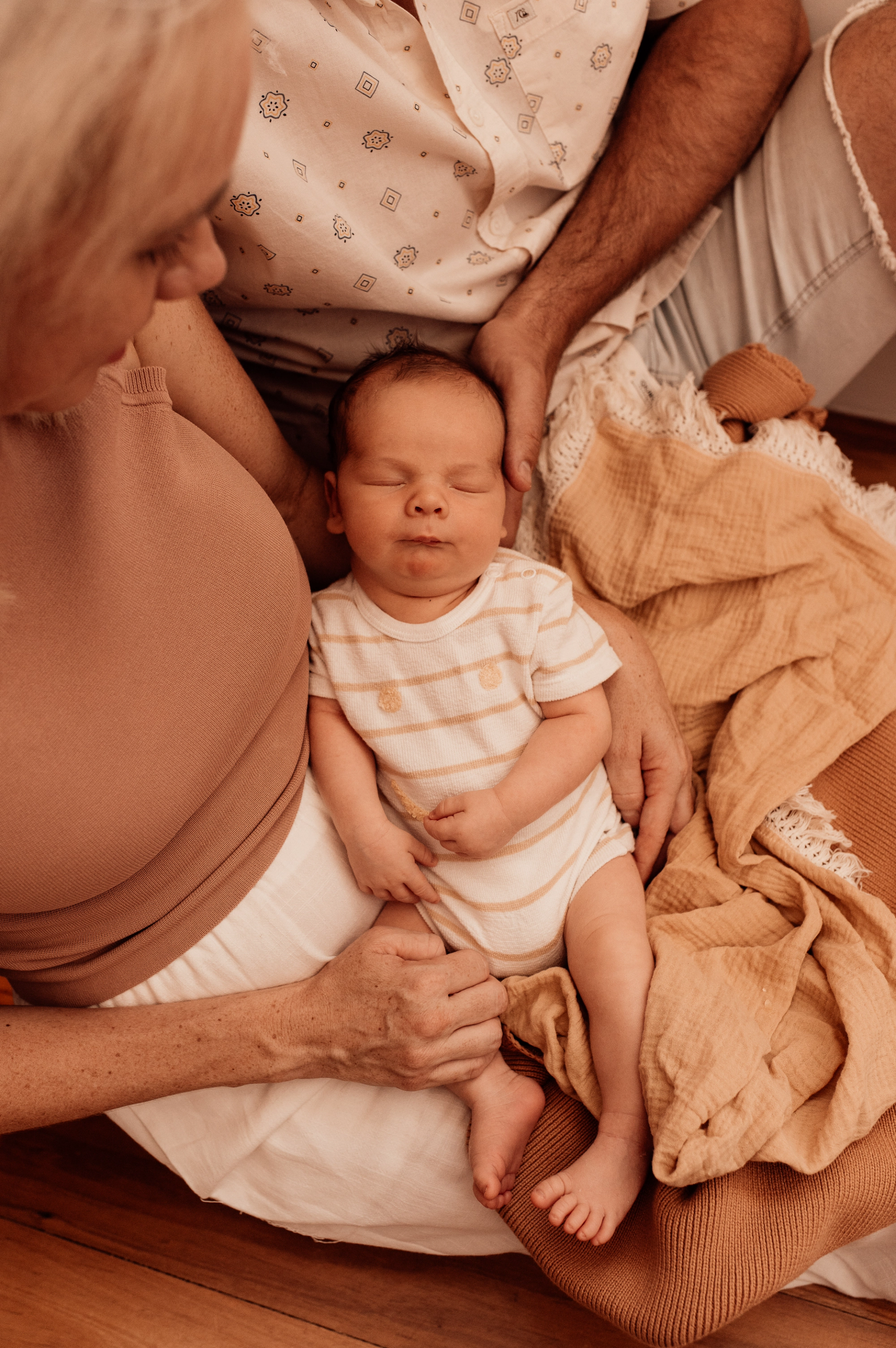 Mother and father with newborn in Perth