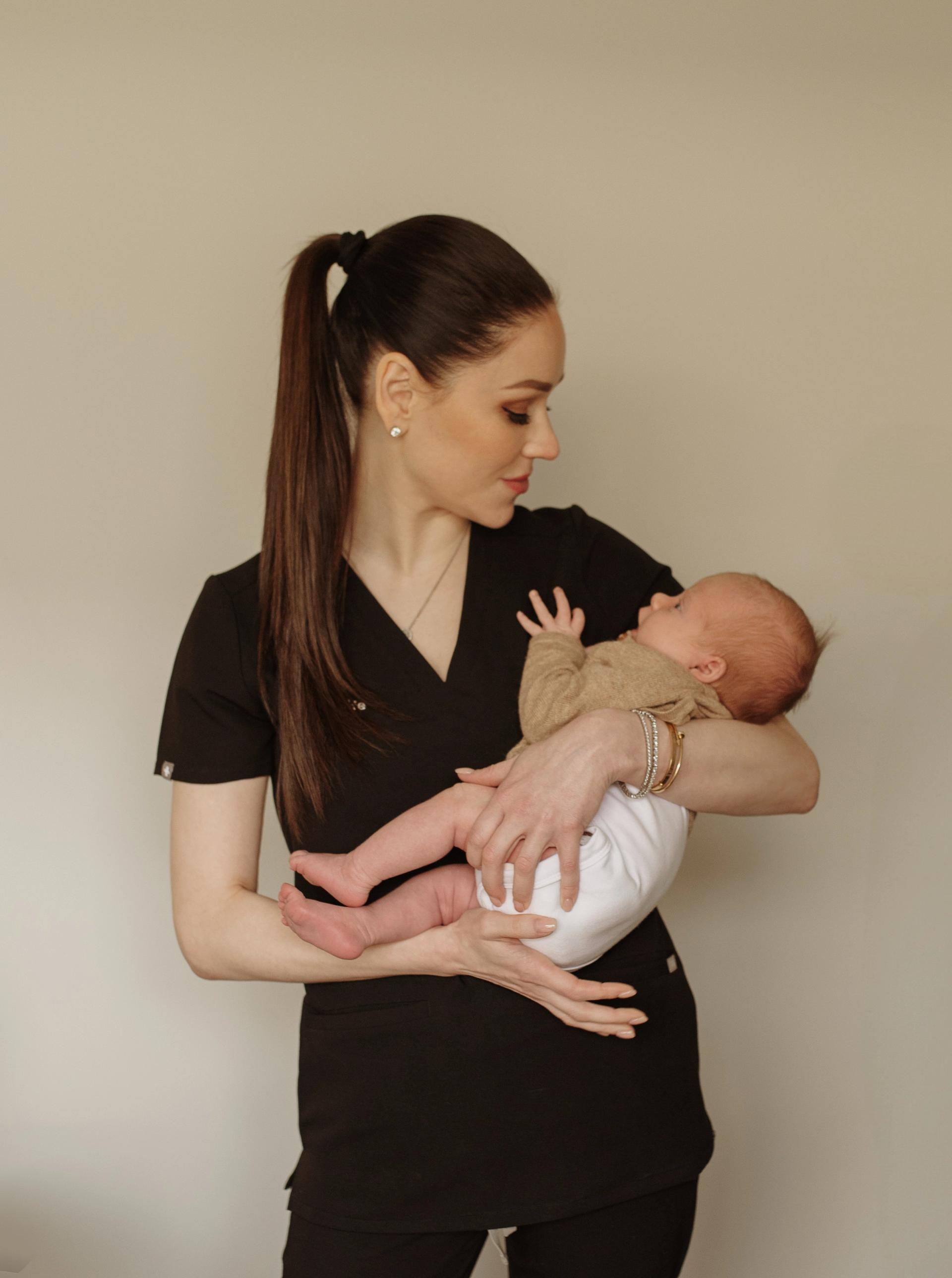 Megan holding newborn in Perth