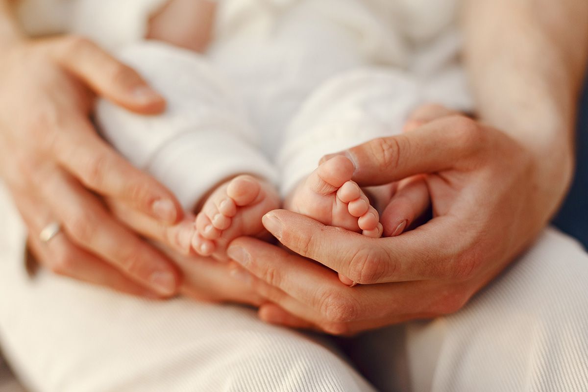 Parent holding their baby in Perth