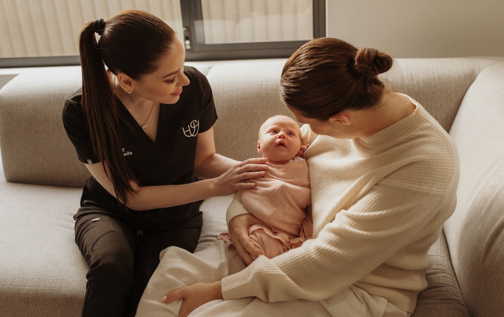 Mother and Meg with a newborn baby