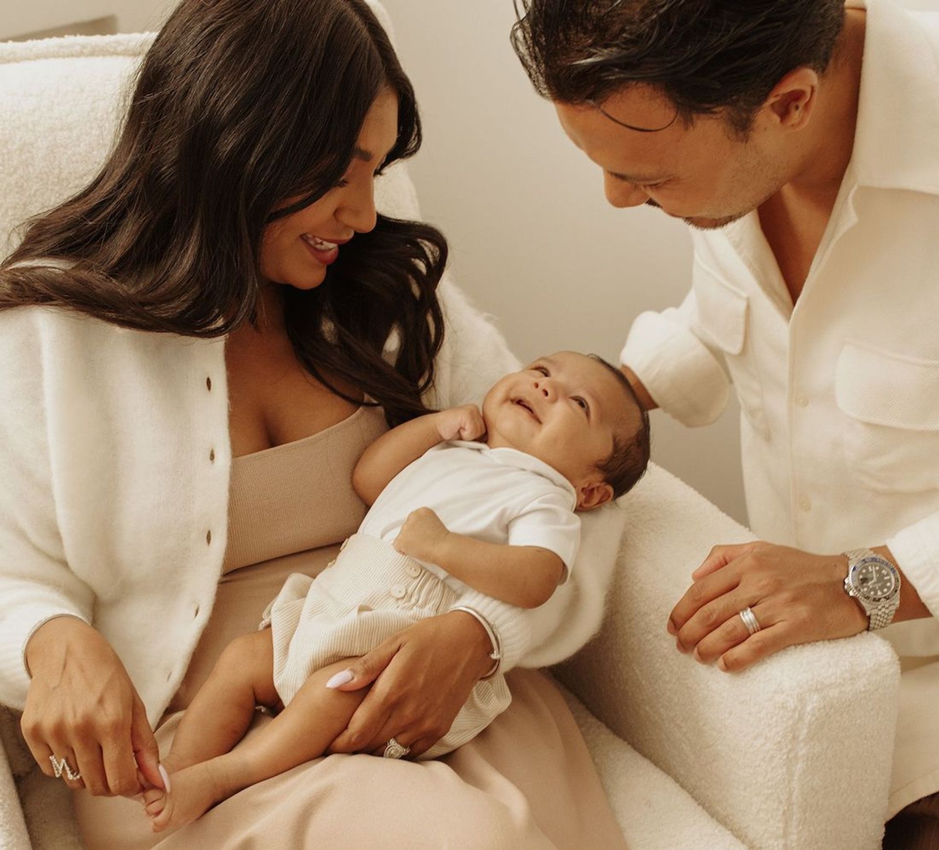 Smiling parents with baby during in-home Hush Healthcare support visit in Perth