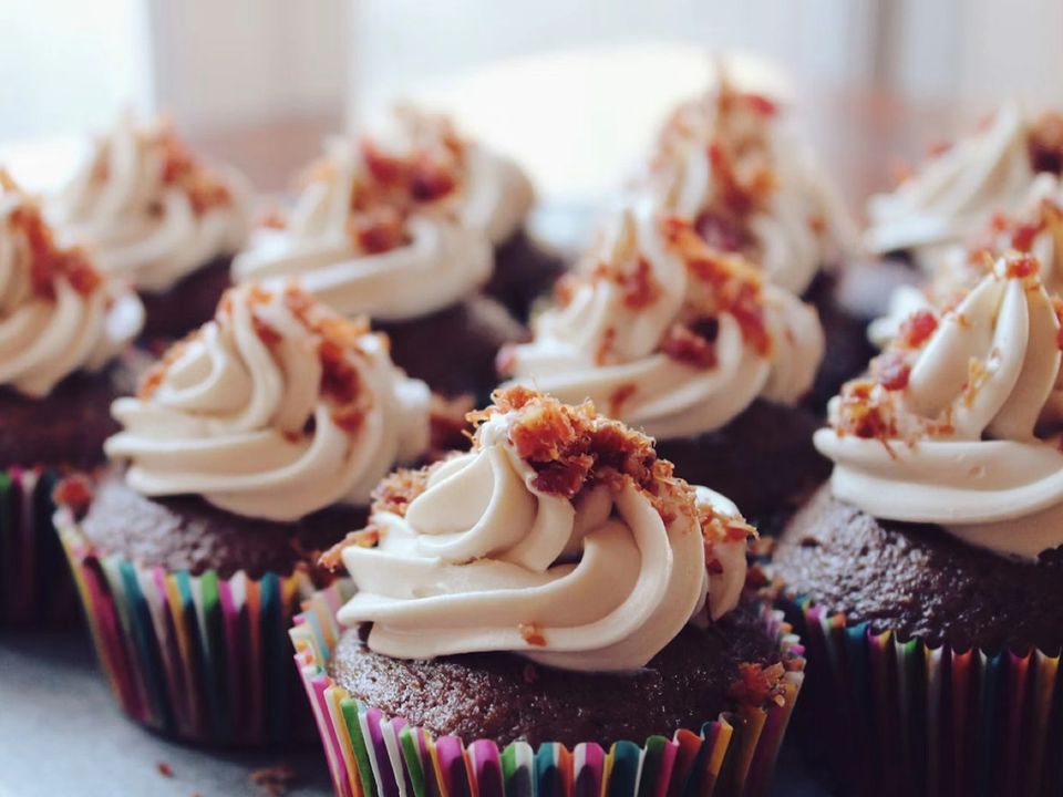 Chocolate cupcakes with swirls of cream frosting