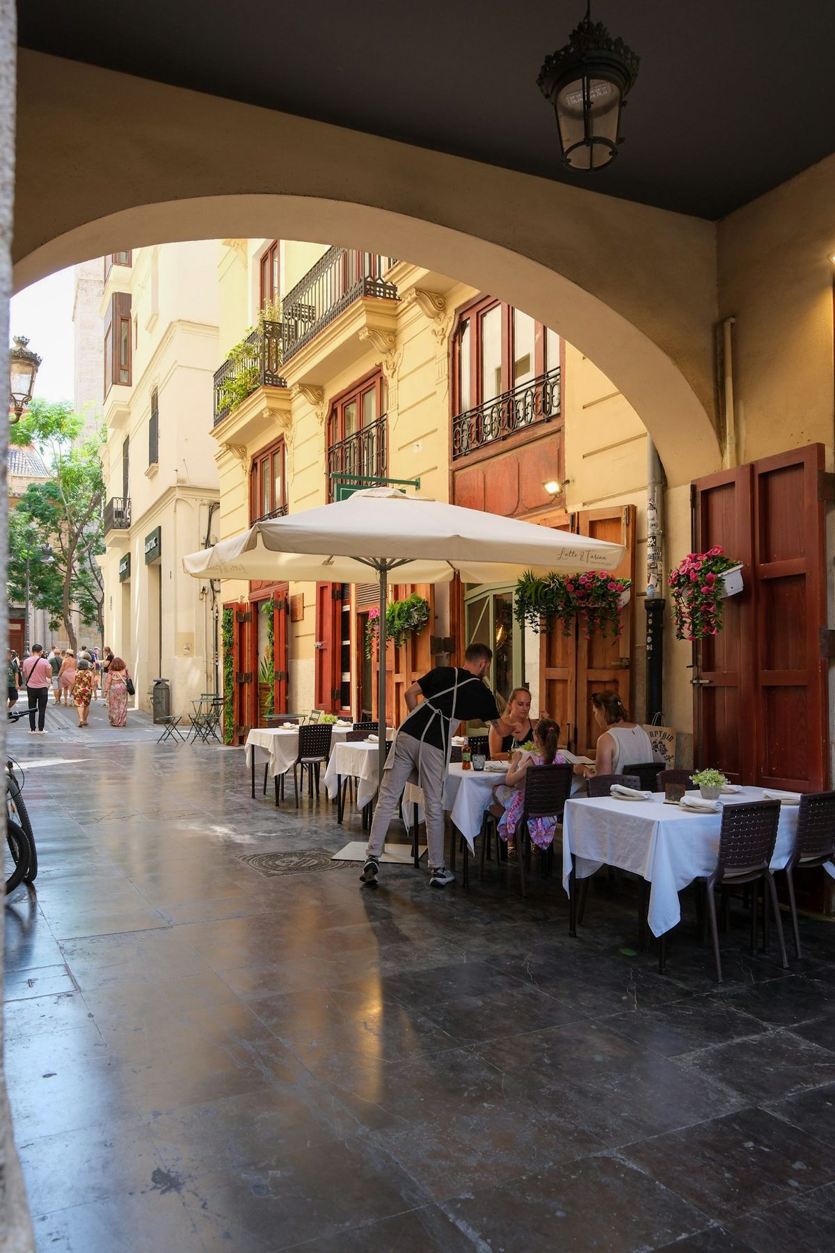 A relaxed terrace lunch in a Spanish old town, the unhurried pace the Non-Lucrative Visa is built for