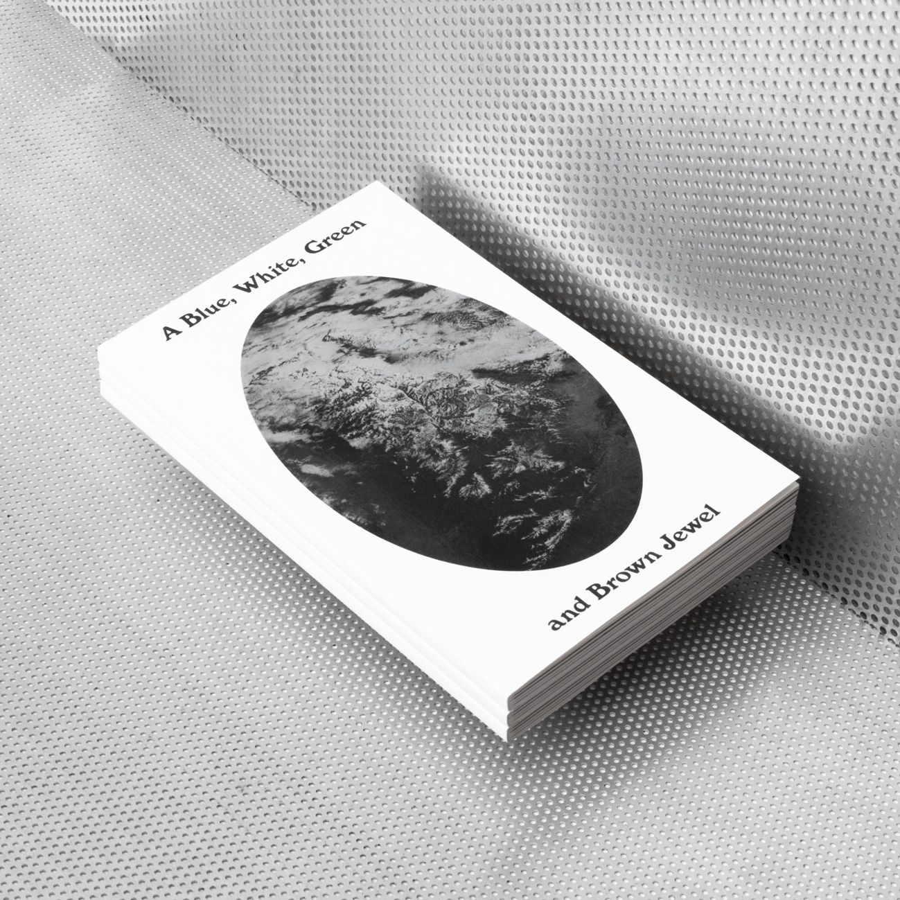 A Blue, White, Green and Brown Jewel