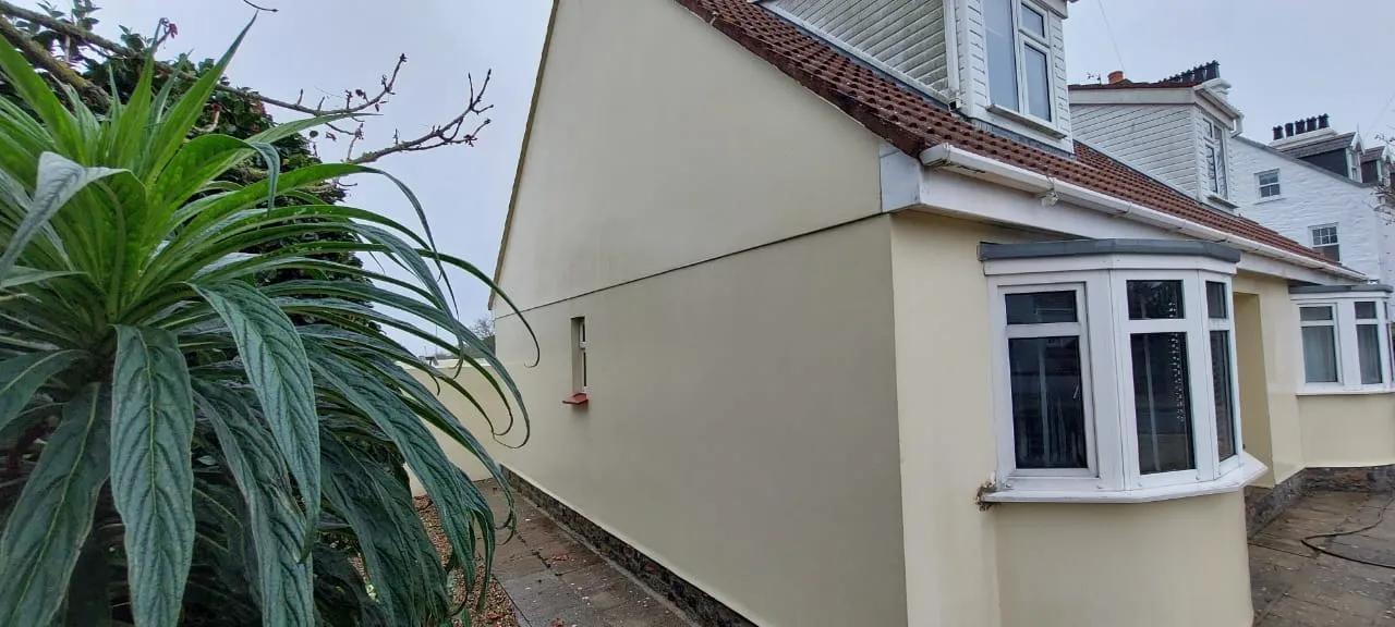 Local home with clean render wall, after