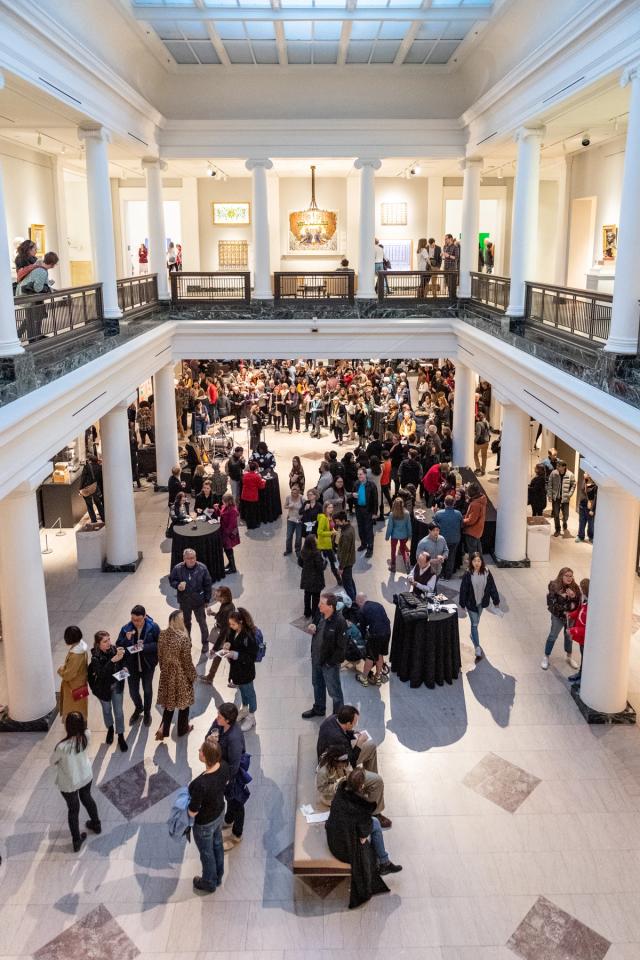 A crowd at an art opening at UMMA 