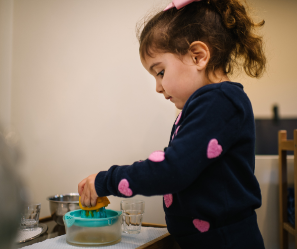 Girl squeezing lemon