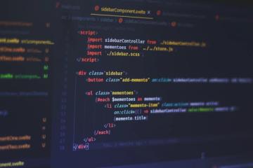 frontend master - a laptop screen displaying source code of a svelte code example