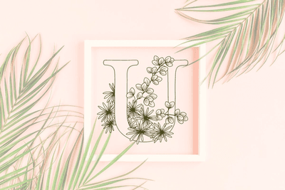 Letter U graphics with floral background