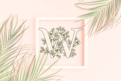 Letter W graphics with floral background