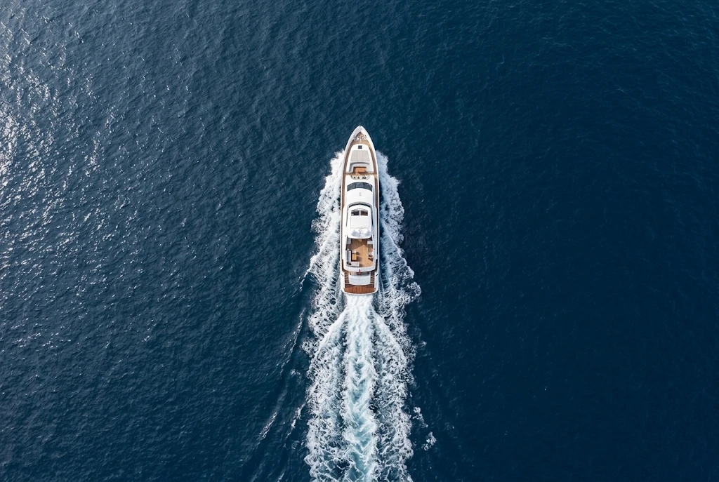 Aerial view of a motor yacht cruising at sea