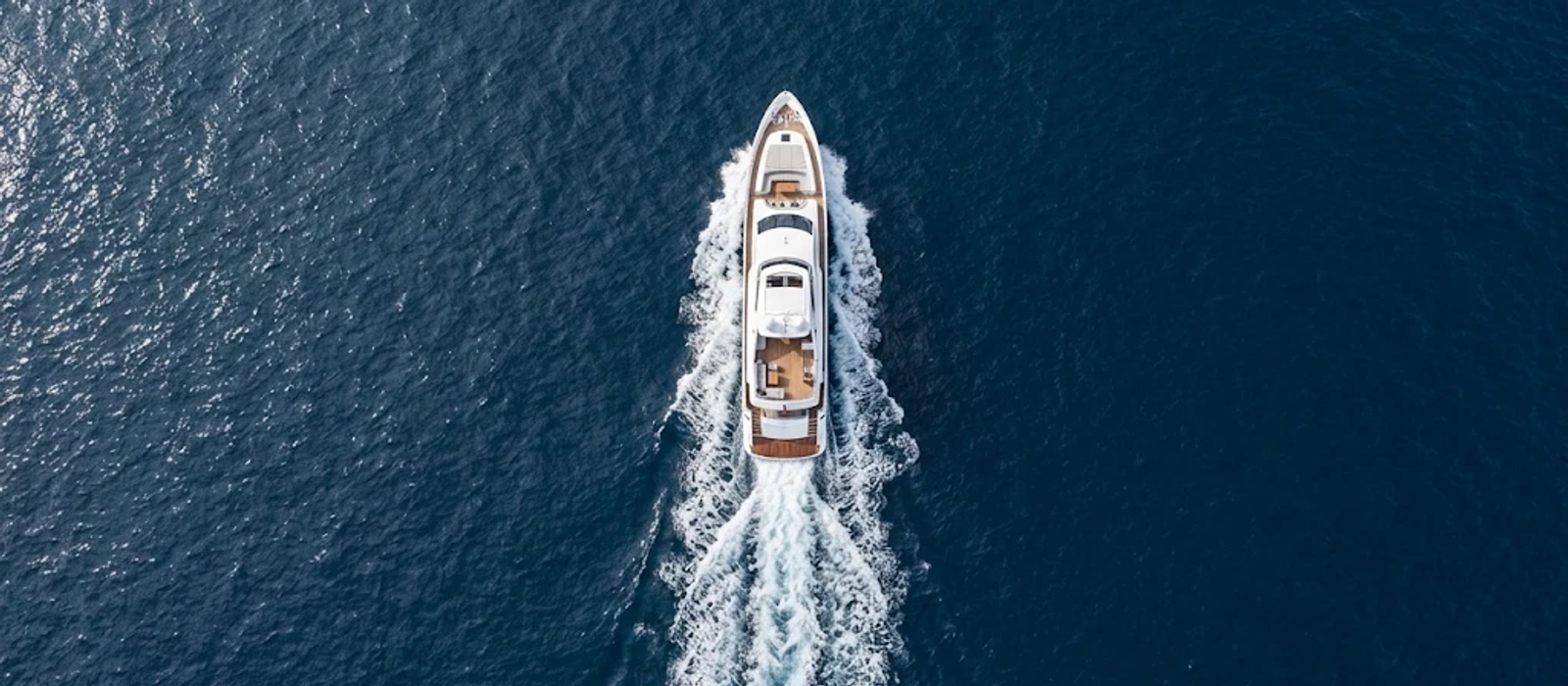 Aerial view of a motor yacht cruising at sea