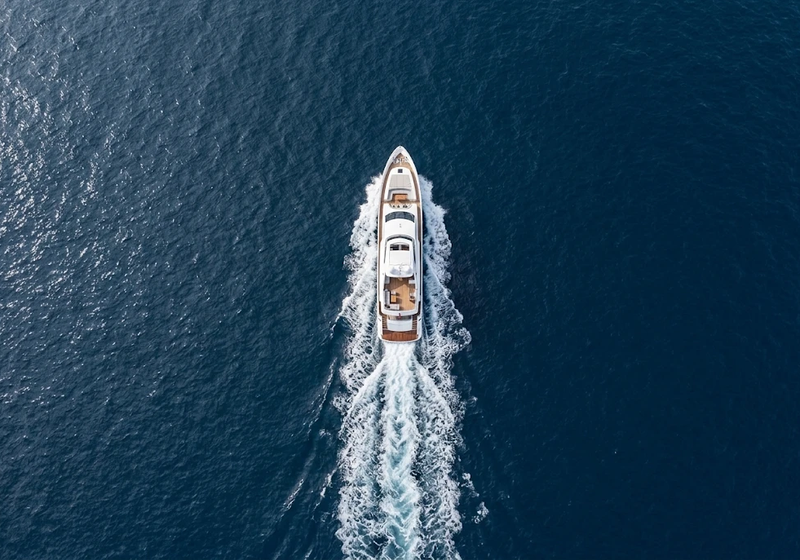 Aerial view of a motor yacht cruising at sea