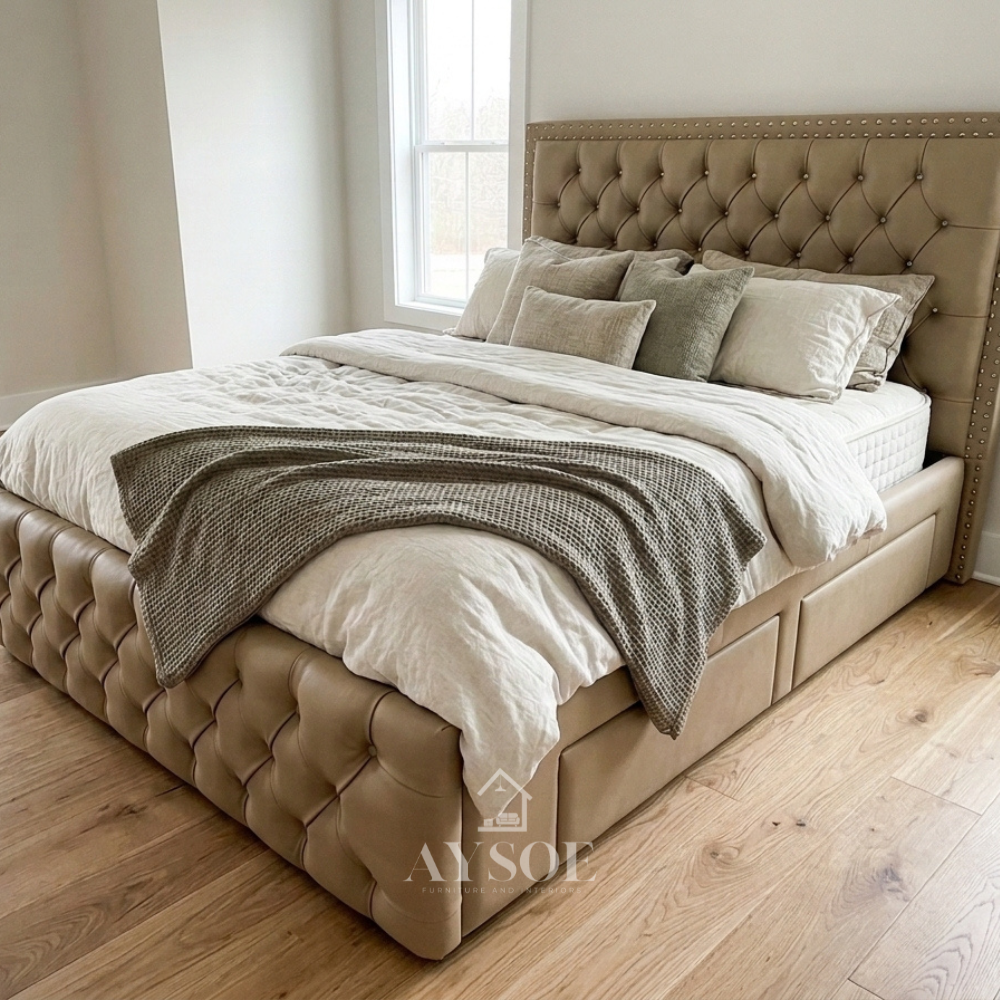 Camel-tan leatherette bed with a tufted headboard, nailhead trim, and matching footboard. Easy to clean. Available in various sizes, in fabric or leather, with optional storage or pull-out.
