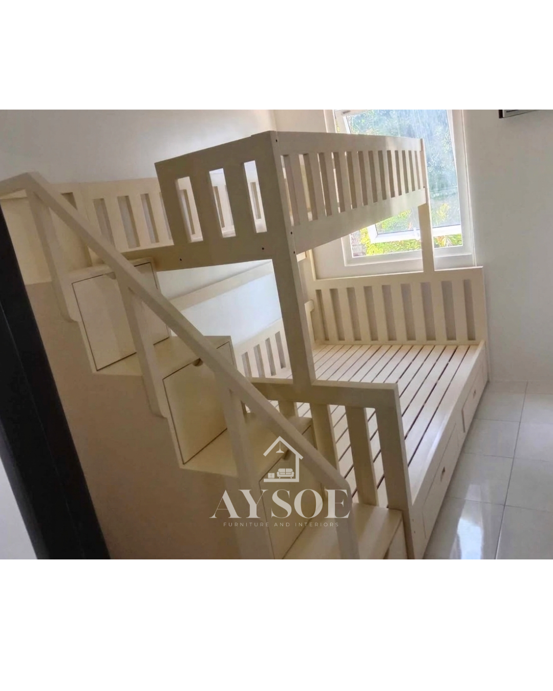A cream white solid wood bunk bed with a single upper bunk, a wider lower bed, a staircase with four storage drawers, and two more drawers under the bed. Sturdy and space-saving for shared rooms.