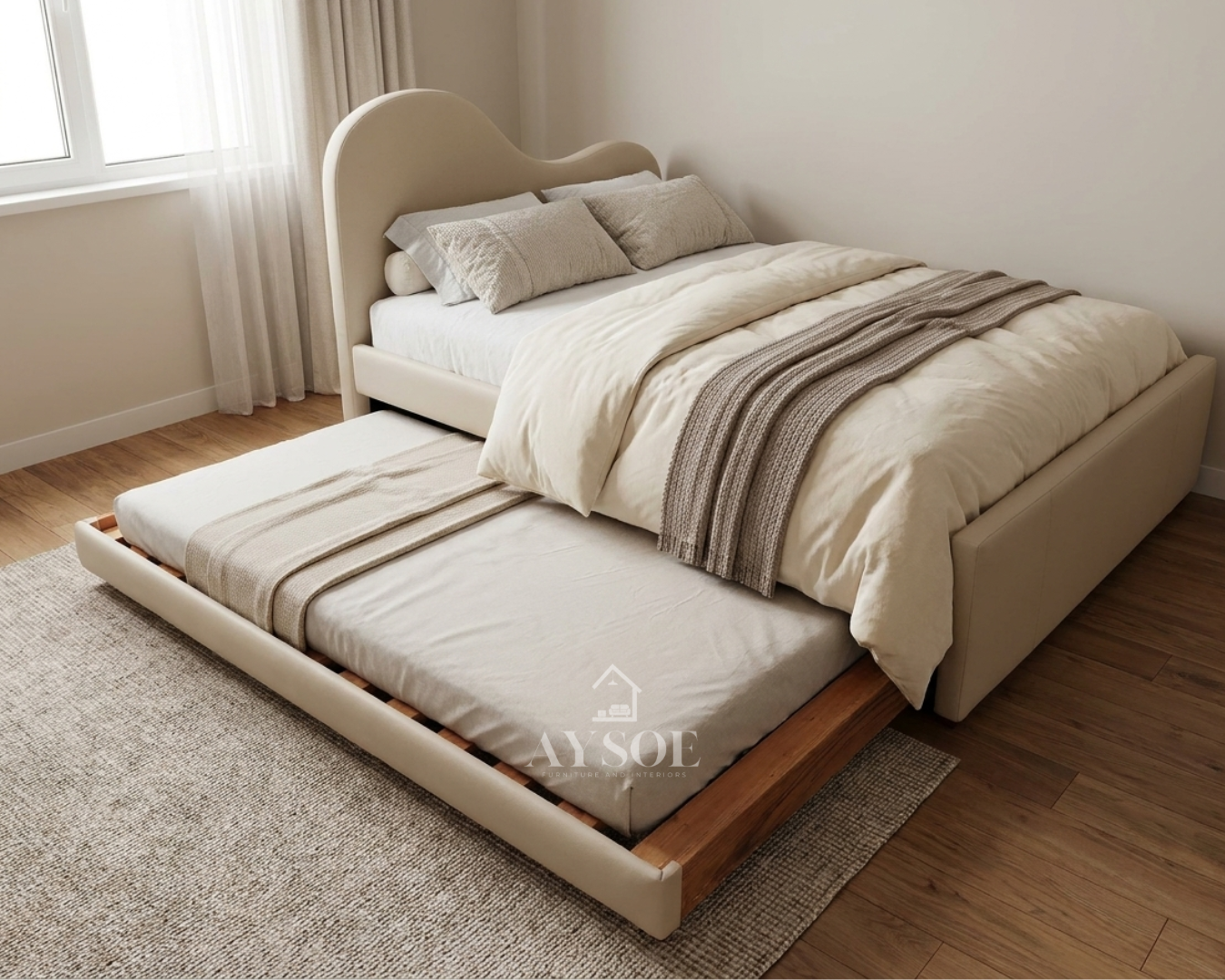 A single bed frame in soft cream leatherette, with a wavy cloud-shaped headboard and a pull-out trundle bed underneath. Two beds in one, great for kids and small rooms.