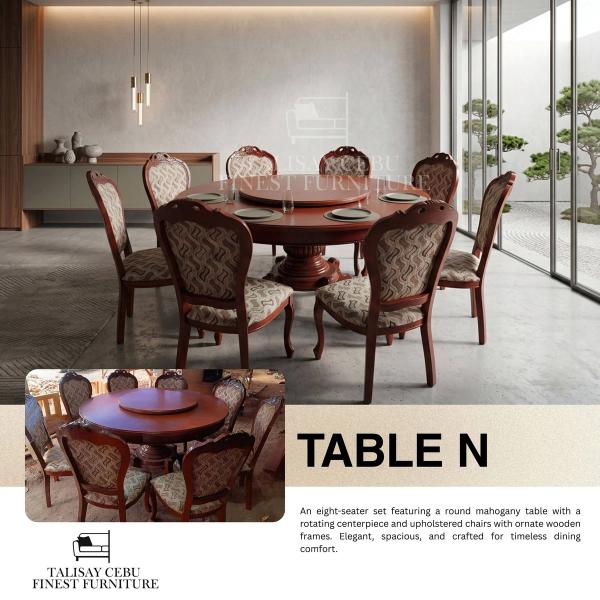 Table: A large, round mahogany dining table featuring an integrated, raised rotating centerpiece (Lazy Susan) in the middle. The table is supported by a thick, ornate pedestal base with elegant carved details.