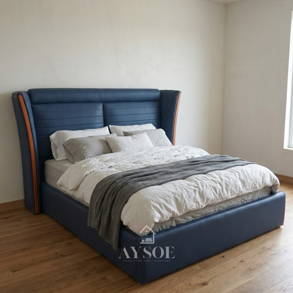 Navy blue leatherette bed with a tall curved wingback headboard, horizontal channel panels, and quilted diamond-stitch wings edged in warm wood. Fully wrapped frame with a solid platform base.