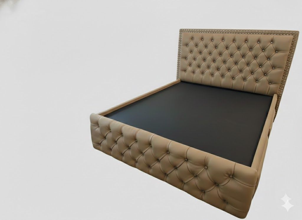 The mahogany frame is upholstered in a light cream or tan leatherette. It retains the signature diamond button-tufting on both the headboard and the footboard, accented with small metal nailhead trim along the borders.