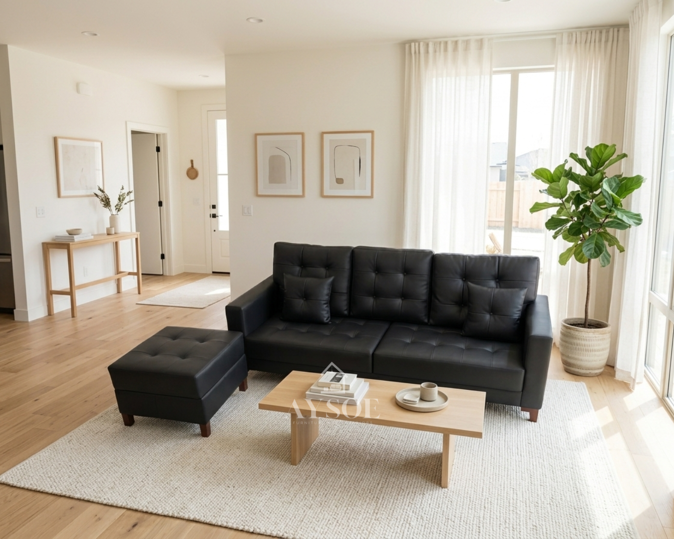 A modern black leatherette three-seater sofa with square-tufted cushions, boxy arms, two throw pillows, and a matching ottoman on slim wood legs. Sleek, easy to wipe clean, and made to order.
