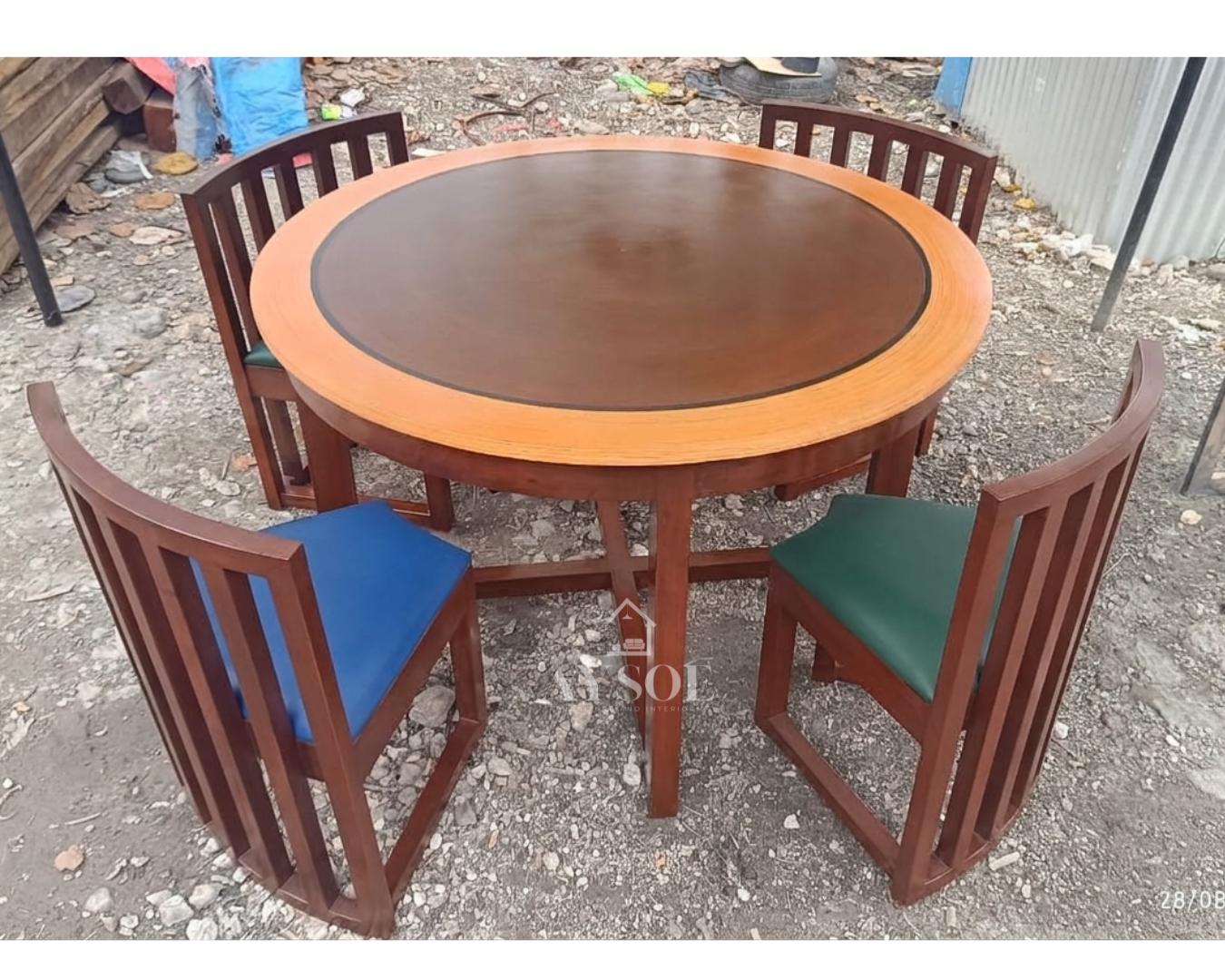 A round 4-seater dining set with a two-tone wood tabletop, a sturdy mahogany base, and four curved slatted-back chairs with cushioned seats in your choice of color. Solid wood, made to order.