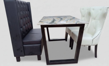 The chairs have decorative nailhead trim.