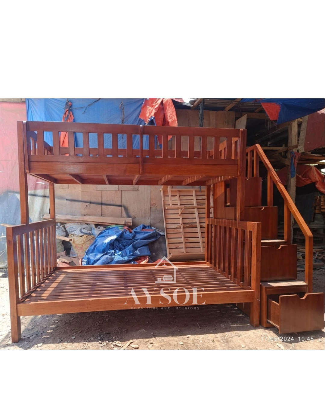 A mahogany-finish solid wood bunk bed with a single upper bunk, a wider lower bed, and a staircase with pull-out storage drawers. Sturdy and space-saving for shared rooms.