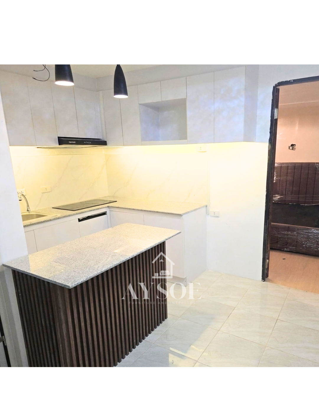 A modern L-shaped kitchen set with handleless grey marble-look cabinets, a granite-look countertop, and a fluted walnut island. Bright, roomy, and ready for cooking and entertaining.