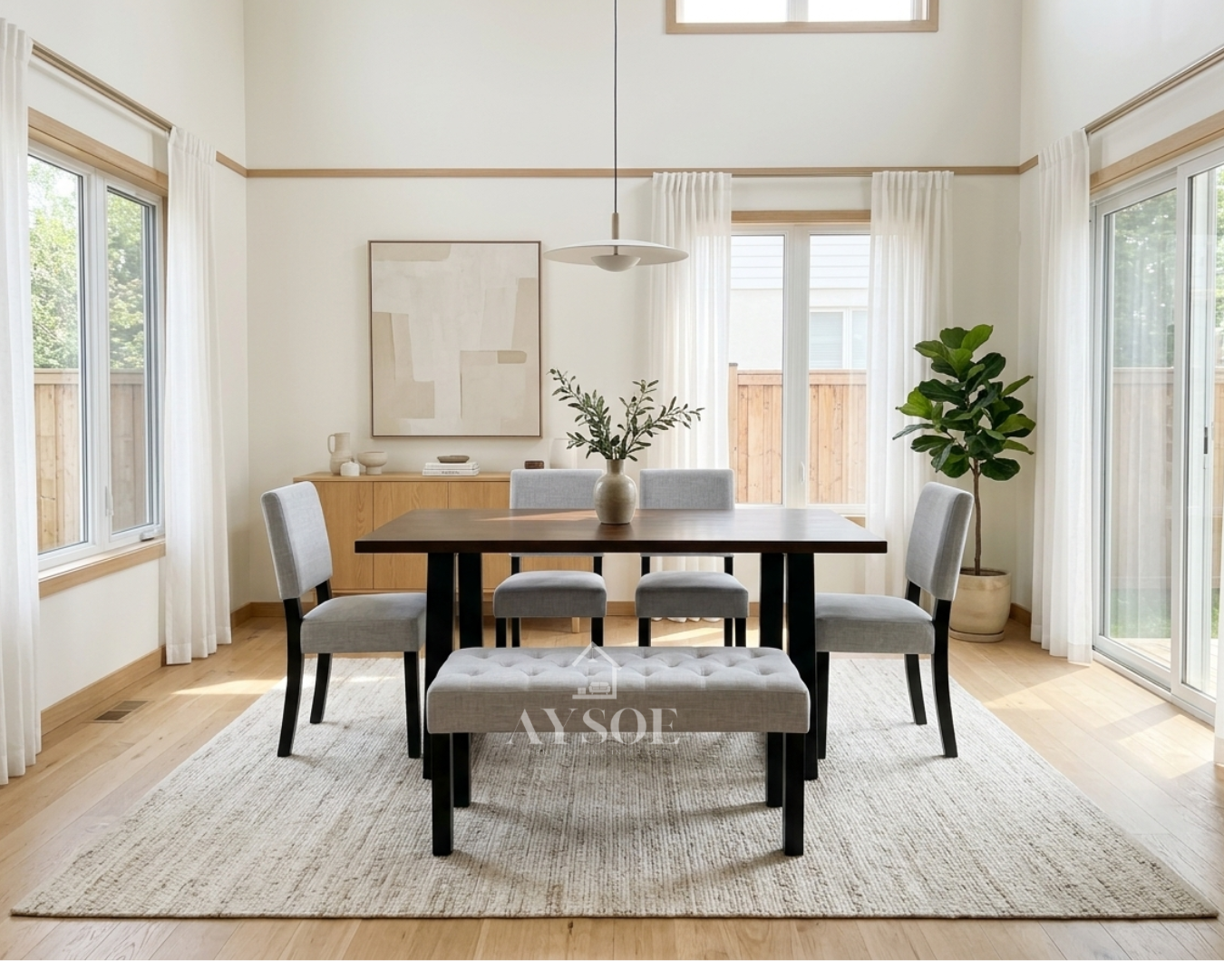 A modern dining set with a dark walnut wood top, bold black trapezoid legs, four light grey upholstered chairs, and a matching tufted bench. Comfortable, stylish, made to order.