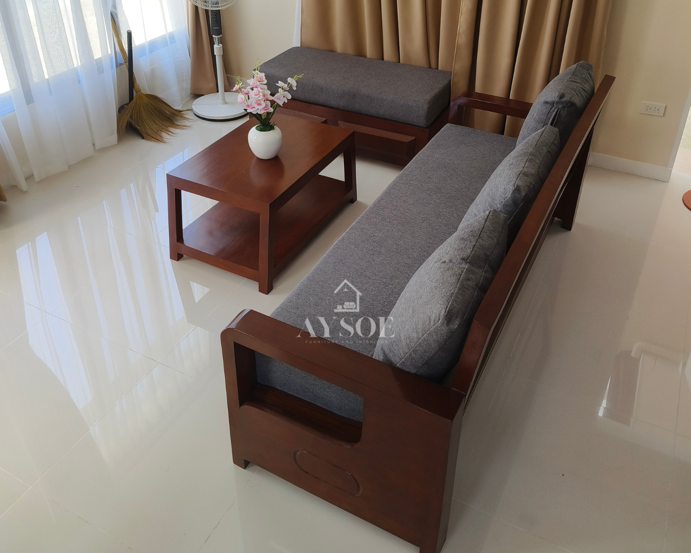 Cherry-finish solid wood living set: 3-seater sofa, matching chaise bench, and coffee table, with thick gray cushions and large lumbar pillows. Comfortable and easy to style.