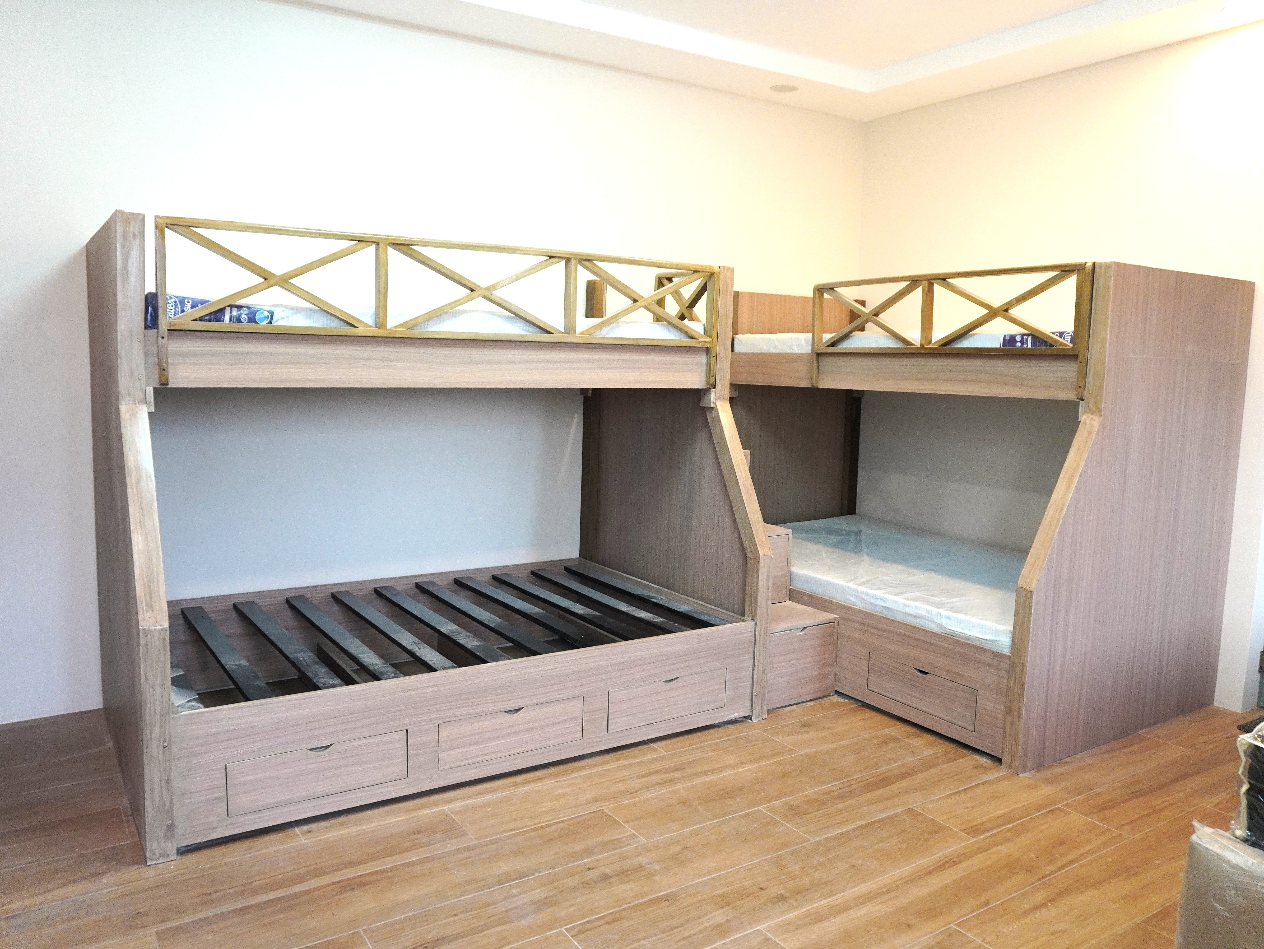 Space-saving L-shaped bunk beds with built-in stairs and roomy storage drawers.