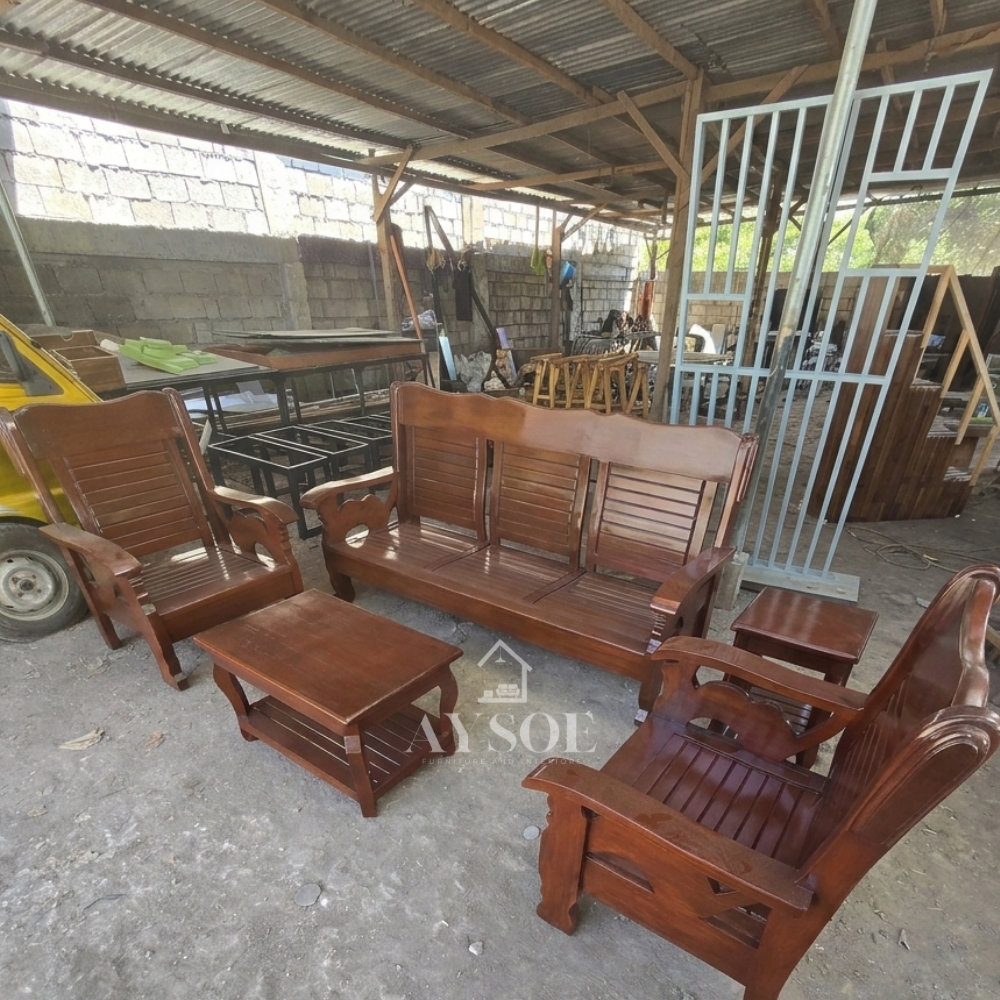 The backrests feature vertical wooden slats, and the lower frame components have classic scalloped or curved detailing.