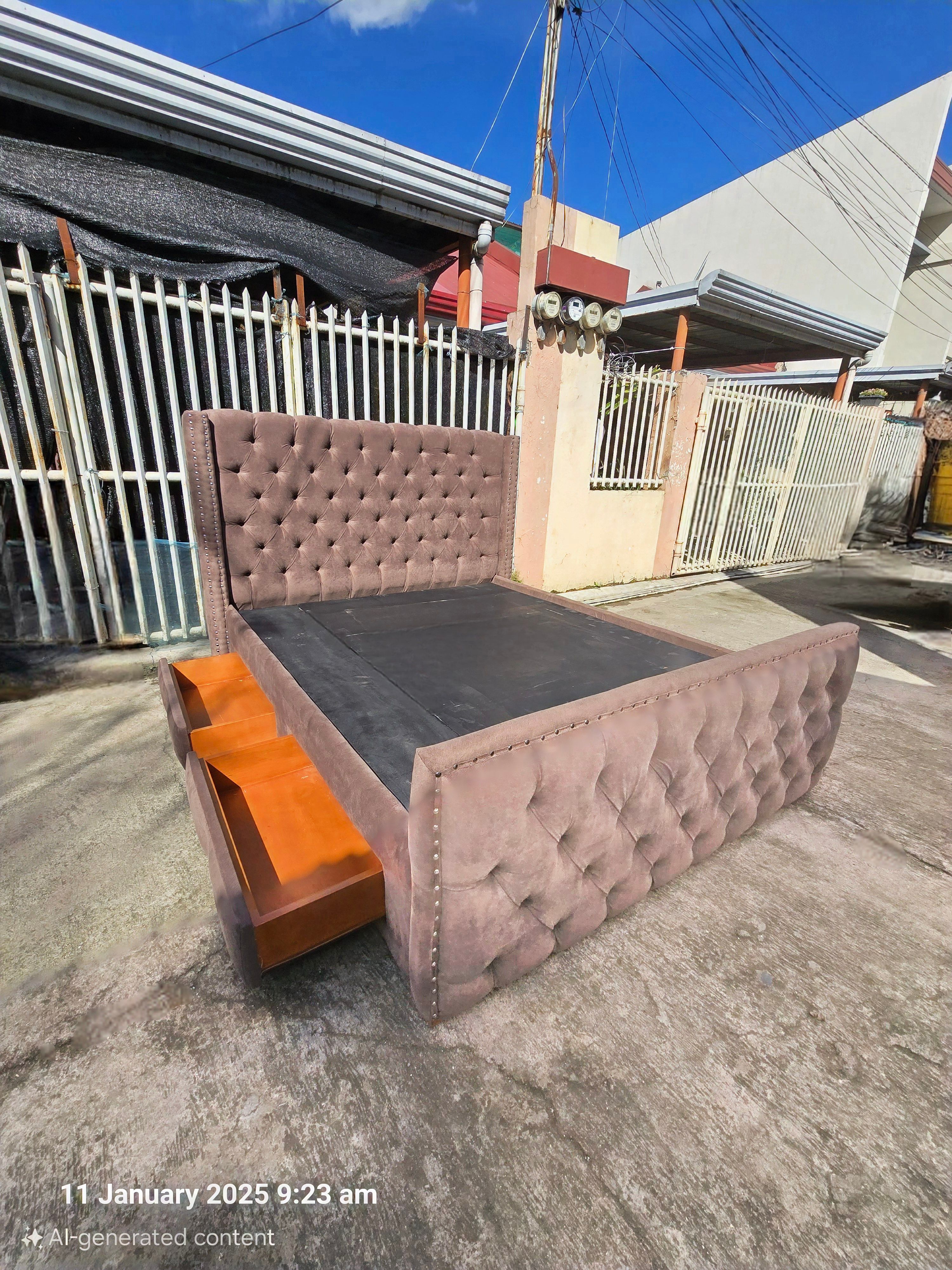 A classic, chocolate brown upholstered bed frame featuring deep tufted button detailing on both the high headboard and the footboard. The edges are accented with a silver nailhead trim.