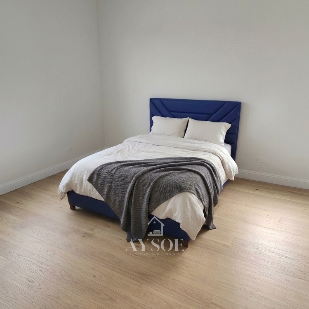 Mahogany wood bed frame upholstered in royal blue leatherette. Available in various sizes, in fabric or leather, with optional storage or pull-out.