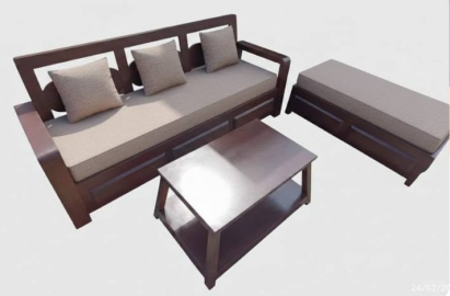  A matching dark wood, two-tiered center table sits in the middle.
