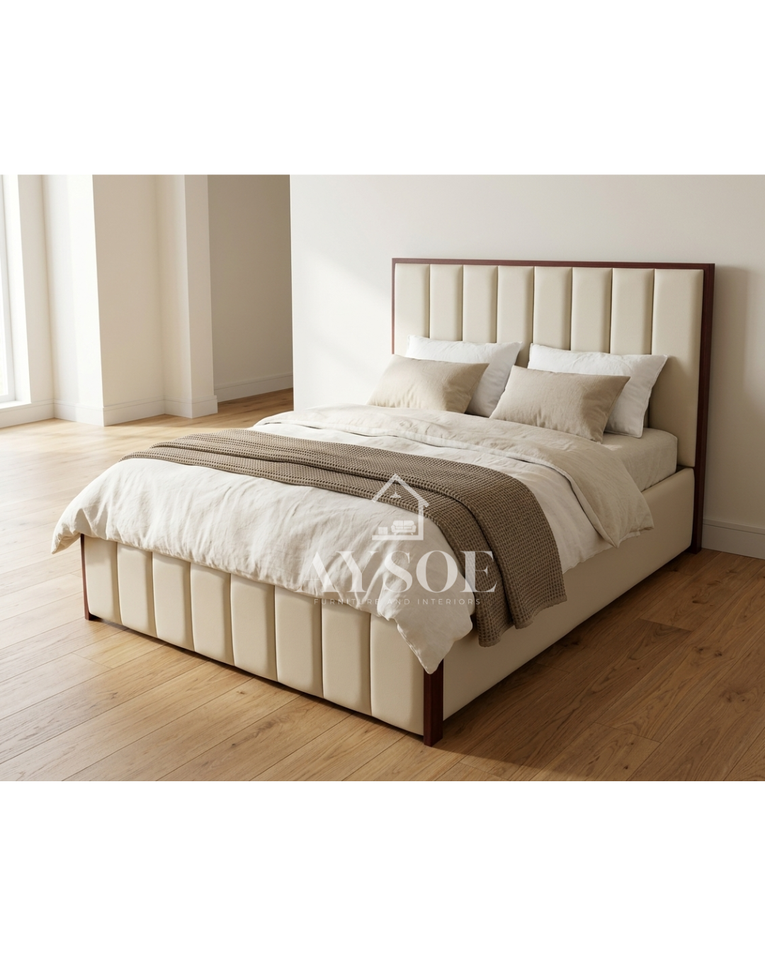 A platform bed frame in cream leatherette, with a tall channel-tufted headboard, a matching footboard, and dark mahogany wood trim. Clean, elegant, and built to last.