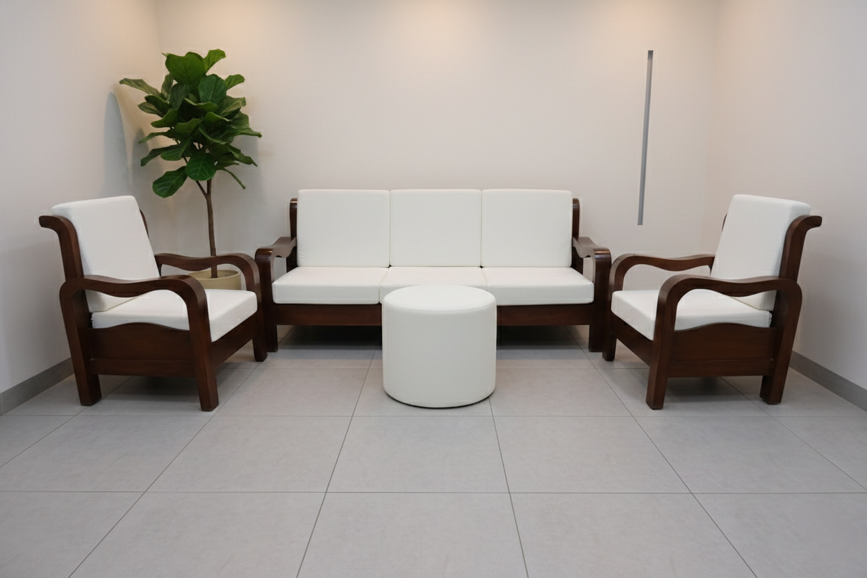 A cylindrical, fully upholstered white round ottoman sits directly in the center, functioning as a modern coffee table or footrest.