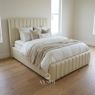 Cream leatherette bed with vertical channel panels on the headboard and footboard. Wrapped frame, easy-wipe finish, solid platform base. Available in various sizes, with optional storage or pull-out.