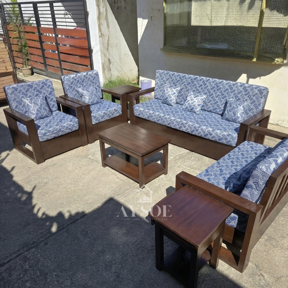 Dark walnut wood living set with blue-and-white patterned cushions: 3-seater sofa, loveseat, 2 armchairs, coffee table, and 2 side tables. Statement seating, made to order.