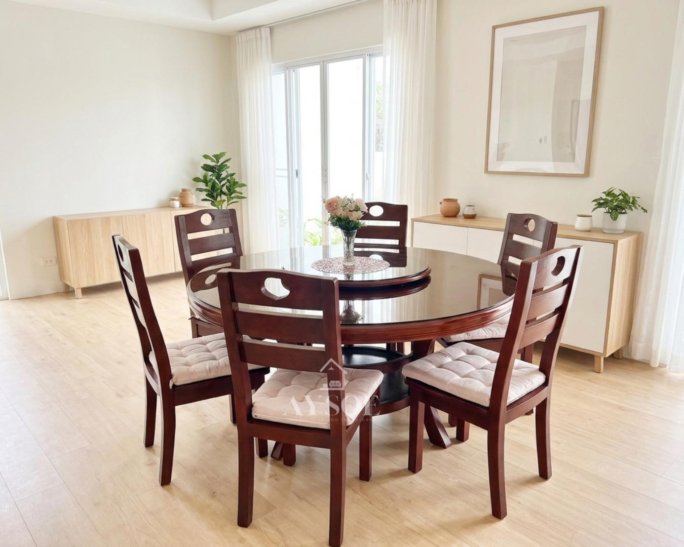 A round 6-seater dining set with a glass tabletop, a built-in rotating lazy Susan, a solid wood mahogany-finish base, and ladder-back chairs with soft tufted cushions.