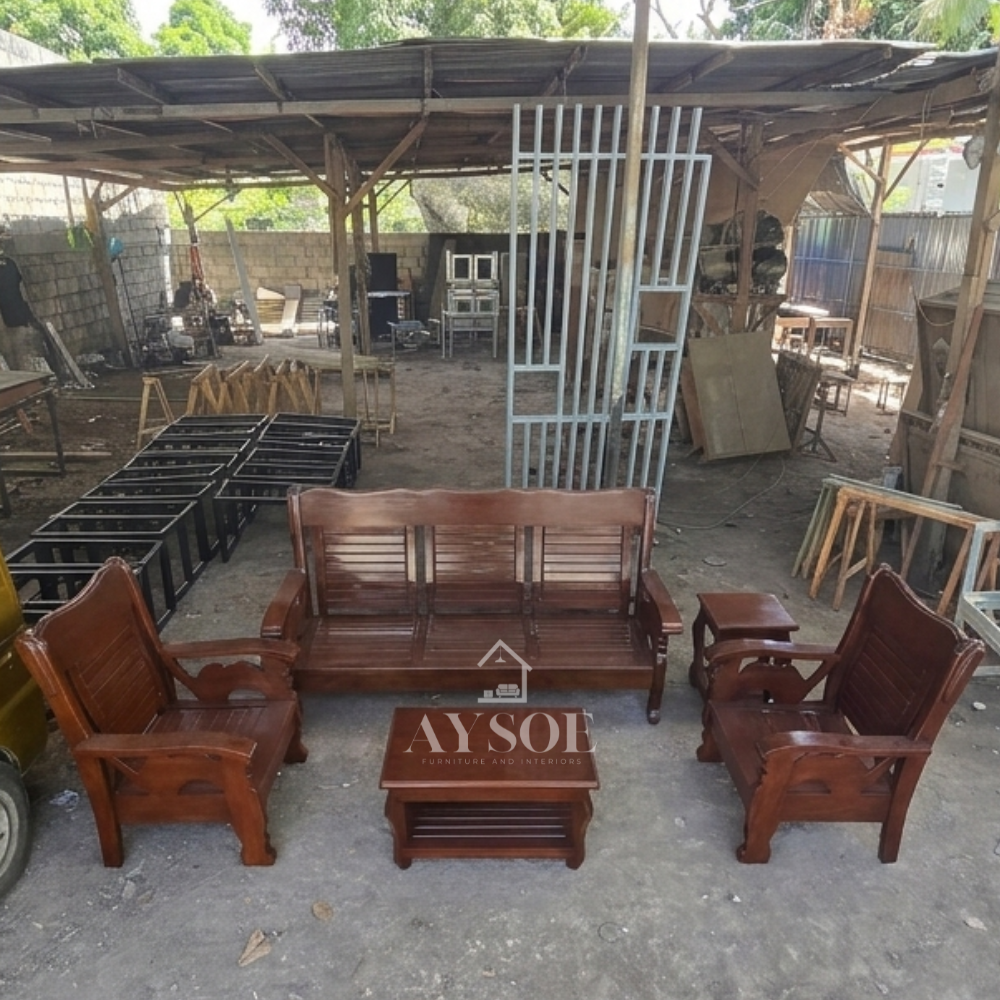 The backrests feature vertical wooden slats, and the lower frame components have classic scalloped or curved detailing.